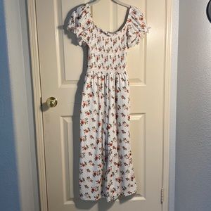 Floral white romper with puffy sleeves size medium